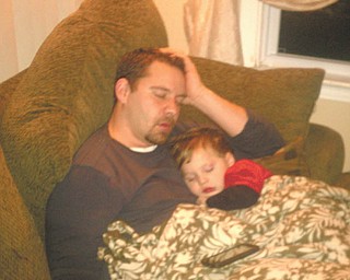 Randy Hovanec and his son Austyn rest after a tough day. They are from North Jackson. Photo submitted by Kelly Hovanec.