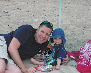 Nick and Nico Gentile of Salem enjoy Nico's first trip to the beach during the recent warm weather. Photo sent in by Andrea Gentile.