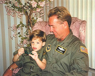 Col. Don F. Warrick of the Air Force Reserve holds his son, Crawford Warrick, who was 4 when this photo was taken. They are from Youngstown.