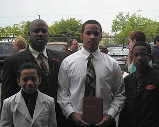 Ronald Casey Jr. stands with his sons Ronald Casey III, Donavan Casey and Jalen Casey. All are from Youngstown.