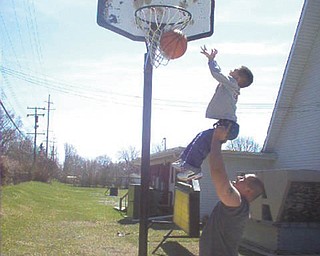 That'll be a great shot! Julian Cordova gives his son Nate a little boost. They are from Canfield. Photo submitted by Evelyn Cordova.
