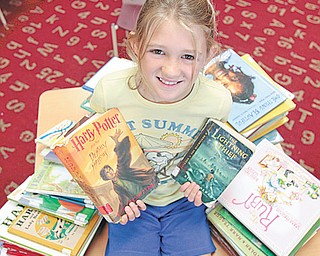 Fourth-grader Jordan Solmen broke the accelerated reading program record at Stadium Drive Elementary
School in Boardman. In the program, students throughout the school read a book of their choosing and then
spend about five minutes taking a reading comprehension test that is worth a certain number of points, depending on the length and level of difficulty of the book. Jordan earned 824 points by the program’s June 4 end date, beating the record by 2 points.