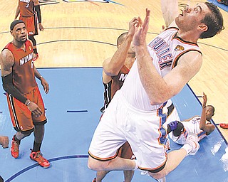 Oklahoma City Thunder power forward Nick Collison (4) shoots against the Miami Heat during Game 1 of the NBA finals Tuesday in Oklahoma City.
