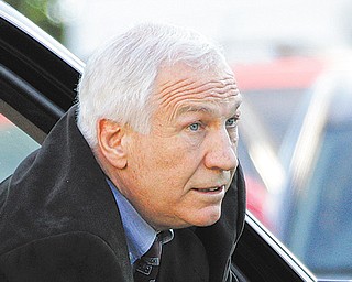 Former Penn State University assistant football coach Jerry Sandusky arrives for the third day of his trial on 52 counts of child sexual abuse involving 10 boys over a period of 15 years at the Centre County Courthouse in Bellefonte, Pa., Wednesday.