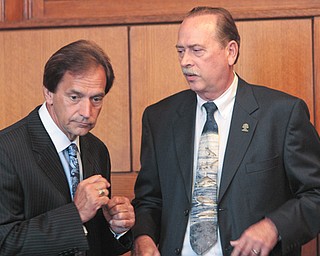 Warren Law Director Greg Hicks, right, on Monday said he thanks the Ohio Attorney General’s office for conducting the yearlong investigation into massage parlors’ activities in the city and thanked the public for “being patient” while a thorough investigation was conducted. With him is Al Bansky of the attorney general’s Bureau of Criminal Identification and Investigation.