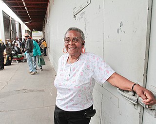 Annie Hall stands outside on the loading platform of the Gleaners Food Bank on Pyatt Street. Gleaners distributes food to the community every Tuesday from the South Side location. Hall has been volunteering there for years.