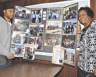 Dr. Doran M. Duke, left, and his mother, Mary Duke, executive director of Teen Straight Talk in Vienna, show off a collage of photos of a recent trip to the Dominican Republic, where they brought several hundred pounds of shoes and clothing to the impoverished people there.
