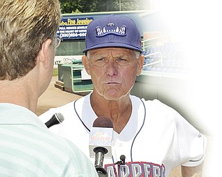 Mahoning Valley Scrappers manager Ted Kubiak #26 takes questions from members of the local media at Eastwood Field on Saturday afternoon.