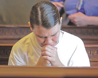 Irene Adkins, mother of murder victim Brandon Adkins, sits silently in Mahoning County Common Pleas Court as sentences are handed down to her son’s teen killers. In a prepared statement to the court, she said she offered
prayers for the convicted boys and their families.
