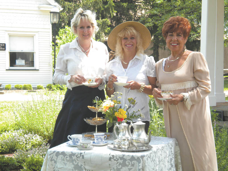 The Holborn Herb Growers Guild Garden Tea Party is scheduled from 2 to 4 p.m. July 8 at Western Reserve Village in the Canfield Fairgrounds (Use Gate 5). Participants can tour the historic buildings, sample herbal teas and delicacies, and enter a hat contest. Features of the day will include demonstrations of herbs and herbs for sale. A teacup and saucer will be available to take home. Children are encouraged to take their favorite doll. Tickets are available by advance sale only. Call 330-718-2013 or 330-533-3802. Tickets are $10 for adults and $5 for children under 10. Preparing for the annual event are, from left to right, Yvonne Ford, Sue Petrollini and Johanne Edel. 