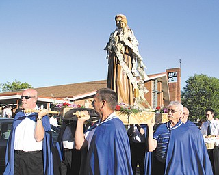 A traditional celebration of the Feast Day of St. Anthony of Padua recently also marked the merger of St. Anthony of Padua and Our Lady of Mount Carmel churches in Youngstown. The event included a Mass, a procession with a statue of St. Anthony, music and food.