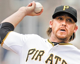 Pirates pitcher Kevin Correia delivers during the first inning of their game against the Tigers in Pittsburgh on Sunday. He gave up just two runs in six innings but was outmatched by Justin Verlander.