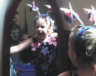 Lilyanah Miller, 3, daughter of Adam Miller and Erica McElroy, gets dressed for the holiday. Photo sent in by Erica McElroy.