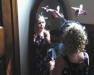 Lilyanah Miller, 3, daughter of Adam Miller and Erica McElroy, gets dressed for the holiday. Photo sent in by Erica McElroy.