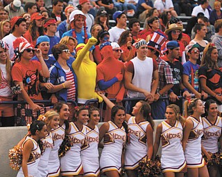 This photo of Mooney cheerleaders and some spirited fans in the crowd behind them came without information.
