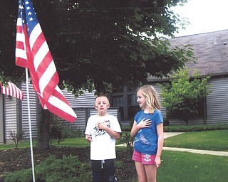 Patty Gordulic of Canfield sent in this photo of her grandchildren, Jarrett and Gianna Gordulic, honoring the flag Memorial Day 2011. Patty said the flag is from the Canfield Rotary and she's proud to fly it.