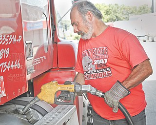 Paul Speero of Boardman fills up his truck with diesel fuel priced at $3.49 at the Travel Center of America at Interstate 80 and state Route 46 in Austintown.