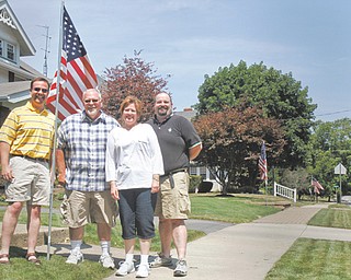 A flag-leasing project is being sponsored by Centenary United Methodist Church in East Palestine. Representatives of the church are David Mollenkopf, who installs flags; Clyde and Michele Hoffmeister, co-chairmen of the flag-leasing committee; and the Rev. Mark McTrusty, pastor.