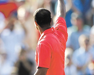 Tiger Woods acknowledges the gallery on the 18th green after winning the AT&T National golf tournament Sunday at Congressional Country Club in Bethesda, Md. Woods may be playing his best golf since 2009, but he also knows that is no guarantee that it will mean he will win a major championship.
