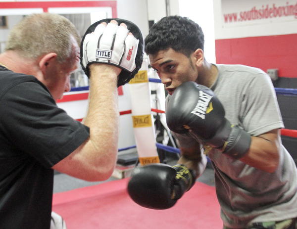 William d Lewis The Vindicator  Boxer Popo Salinas works out with trainer Jack Loew at Southside Boxing Club 7-3-12.