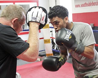 William d Lewis The Vindicator Boxer Popo Salinas works out with trainer Jack Loew at Southside Boxing Club 7-3-12.