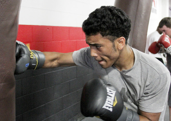 William d Lewis The Vindicator  Boxer Popo Salinas works out with trainer Jack Loew at Southside Boxing Club 7-3-12.