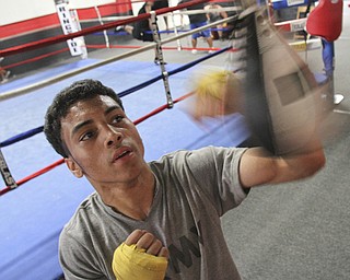 William d Lewis The Vindicator Boxer Popo Salinas works out with trainer Jack Loew at Southside Boxing Club 7-3-12.
