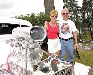 Kenny and Jeanie Hill stand next to their 1934 Chevy that won best paint job for its “Cotton Candy Pink” at the “Back to the ’50s Weekend” festival in New Castle.