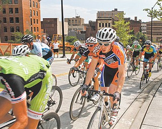 Men Pro 1/2 racers leave downtown Youngstown heading for Youngstown State during their 90-minute criterium at Sunday’s final day of the Tour of the Valley.
