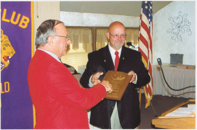 Canfield Lions Club had its 34th installation of officers in June. At left is newly installed President Dan Grossman presenting Harry Pancher, past president, the King Lion Plaque. PDG Lion Ted Filmer conducted the installation of the following 2012-2013 officers: Grossman, president; Carmela Abraham, second vice president; Phil Bova, treasurer; Rich Yager, tail twister; Marilyn Schmidt, lion tamer; Pete Cannell, membership and public relations; and Pancher, immediate past president.