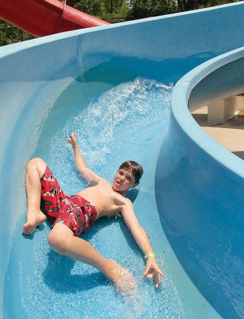 Joey Fusel, 8, of Canfield rushes down a water slide Monday at the D.D. & Velma Davis Family YMCA in Boardman.
The temperature is supposed to be in the mid-90s Tuesday, according to the National Weather Service forecast.
The high temperature for the Valley on Monday was 90 degrees. Tuesday will be the 53rd day so far this year to have a high temperature of at least 80 degrees, according to weather service statistics.