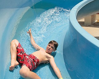 Joey Fusel, 8, of Canfield rushes down a water slide Monday at the D.D. & Velma Davis Family YMCA in Boardman.
The temperature is supposed to be in the mid-90s Tuesday, according to the National Weather Service forecast.
The high temperature for the Valley on Monday was 90 degrees. Tuesday will be the 53rd day so far this year to have a high temperature of at least 80 degrees, according to weather service statistics.