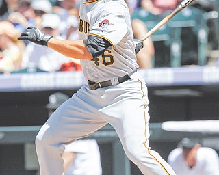 The Pittsburgh Pirates’ Garrett Jones follows the flight of his leadoff single off Colorado Rockies relief pitcher Matt Reynolds in the fifth inning of Wednesday’s baseball game in Denver. The Pirates rallied to defeat the Rockies, 9-6, with Jones having three hits, including one of Pittsburgh’s four home runs.