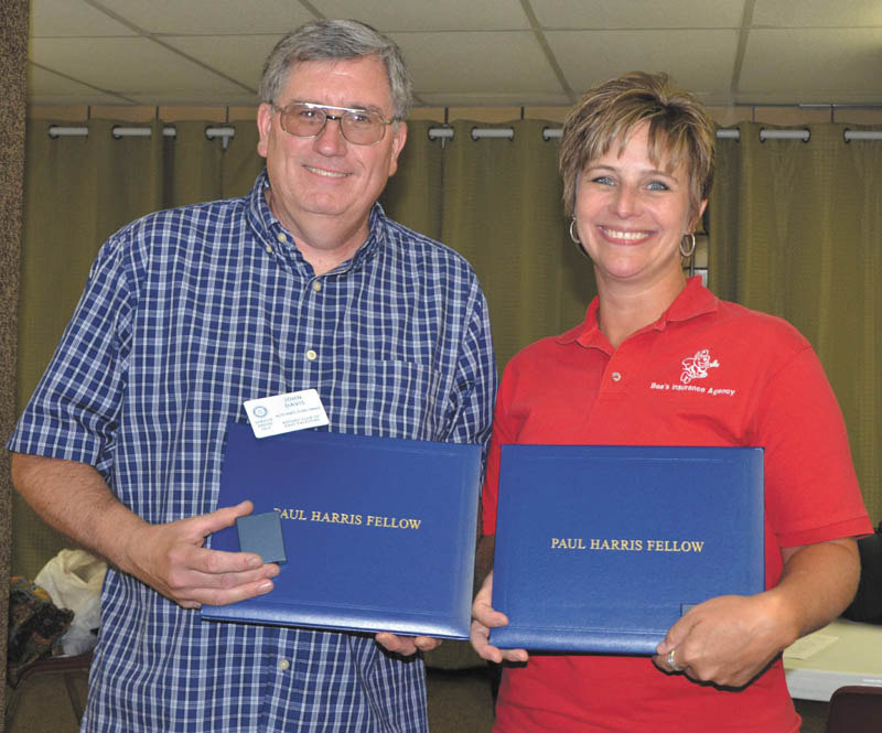 East Palestine Rotary Club members John Davis, left, and Kerri Stewart recently received Paul Harris Fellow
Awards. This award is one of the highest in Rotary 
International and is named after Rotary’s founder, Paul Harris, who formed the world’s first service club in 
Chicago in 1905. His intention was to recapture the same friendly spirit he had felt in the small towns of his youth.
