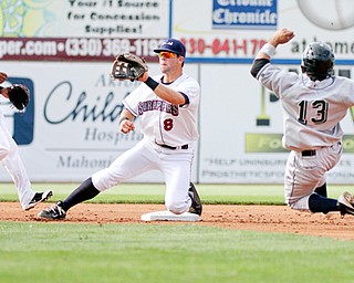 Scrappers Joe Sever, center, waits for a throw as Jammers Yeison Hernandez tries to steal second base. Hernandez was out on the play. Robel Garcia, left, had the game-winning hit for Mahoning Valley in the 2-1 win.