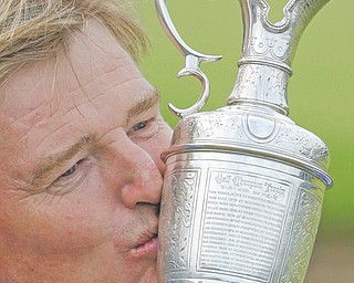 Ernie Els of South Africa kisses the Claret Jug trophy after winning the British Open Golf Championship at Royal
Lytham & St Annes golf club, Lytham St Annes, England Sunday.