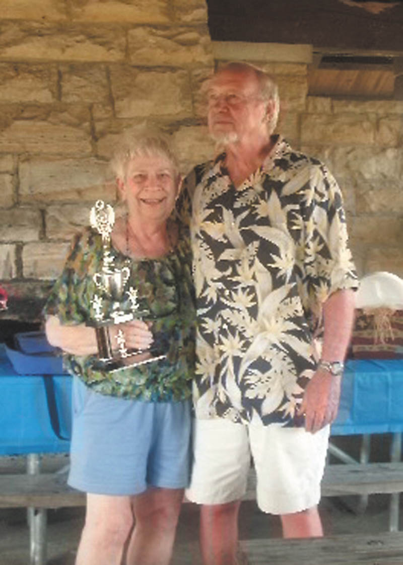 Peggy Leone, one of the original boaters who started the Fourth of July Guilford Lake Boat Parade 30 years ago, holds the “retired” traveling Commodore’s Cup that she received from Bob Gause, Guilford Lake Civic Association president. Leone and others were recognized at the annual awards picnic at the state park pavilion. Joyce Lasky, 2012 commodore, recognized winners in the “Your Favorite Holiday” event. Winners are the Halloween boat of Jason and Carol Brown, first place; April Fool’s Day boat of Madalyn James, second; Easter by the Marc Bloor family, third; and St. Patrick’s Day by Rilla Gill, fourth. A new traveling Commodore’s Cup was given to the Browns and Nathan and Angela Benner.
