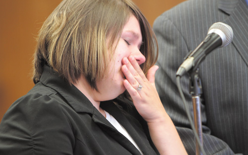 Samantha Yoder of Alliance tries to contain her emotions as she stands before Judge Robert Douglas of Youngstown Municipal Court at her Monday sentencing for vehicular homicide. She was sentenced in the death of Susan Welsh in a Feb. 14 auto accident near Youngstown State University, where Yoder is a student.
