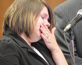 Samantha Yoder of Alliance tries to contain her emotions as she stands before Judge Robert Douglas of Youngstown Municipal Court at her Monday sentencing for vehicular homicide. She was sentenced in the death of Susan Welsh in a Feb. 14 auto accident near Youngstown State University, where Yoder is a student.