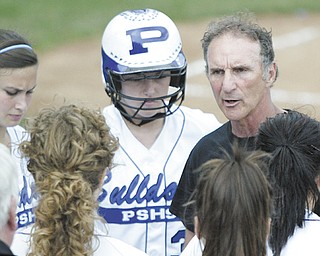 Poland softball coach Reid Lamport, right, talks with his players during the 2011 Division II regional softball
final at Akron Firestone Park. After nearly five decades of coaching, Lamport will be hanging up his cleats and retiring.