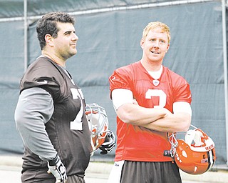 Browns rookie quarterback Brandon Weeden (3) chats with OL John Greco, a Boardman High grad, at a preseason practice. While Cleveland is counting on Weeden to make an immediate impact, coach Pat Shurmur is mum on which QB will get the starting nod.