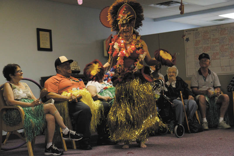 Canfield resident Lana VanAuker just loves to dance. She says she dances everywhere she goes — Italy, Spain, Morocco, Hawaii and right here at home in Mahoning and Trumbull counties. Her most recent audience was a group of senior citizens at the Senior Independence adult day care in Boardman, where she donned a traditional Hawaiian costume and performed the hula. Photo by: MADELYN P. HASTINGS | THE VINDICATOR