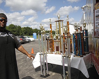 Steve Jackson shows off his many awards from various rib contests at the fourth annual ribs festival at the Mastropietro Winery in Berlin Center, Ohio.
