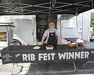 Eddy Erhardt smiles at the fourth annual ribs festival at the Mastropietro Winery in Berlin Center, Ohio on July 21, 2012. He is the owner of Eddys Smoke'n Pit Barbeque.