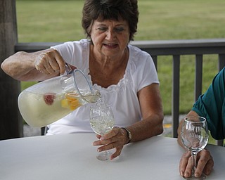 
Flo Arndt pours herself a glass of sangria at the  fourth annual ribs festival at the Mastropietro Winery in Berlin Center, Ohio on July 21, 2012. 