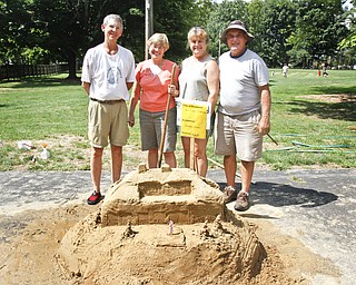 (L-R) Mark Dolak, Jan Crewson, Linda Armstrong and Carl Antonelli make up the group 'Wedesday Walkers' competing in the sand sculpture contest at Mill Creek Park.

