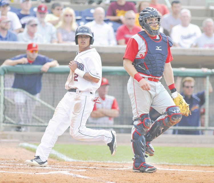 Scrappers base runner Aaron Siliga (2) crosses home plate behind Brooklyn Cyclones catcher Kevin Plawecki to score the Mahoning Valley’s first run of the game. Siliga also tripled, but the Scrappers fell to Brooklyn, 10-5, in front of 3,398 fans at Eastwood Field.
