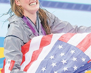 America’s Missy Franklin celebrates winning the women’s 200-meter freestyle swimming semifinal Monday at the Aquatics Centre in the Olympic Park in London. The 17-year-old struck gold earlier in the 100-meter backstroke.