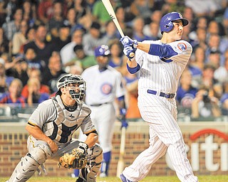 Pirates catcher Michael McKenry watches as the Cubs’ Anthony Rizzo connects for a three-run home run in the fifth inning of Monday’s baseball game in Chicago. Chicago routed Pittsburgh, 14-4.