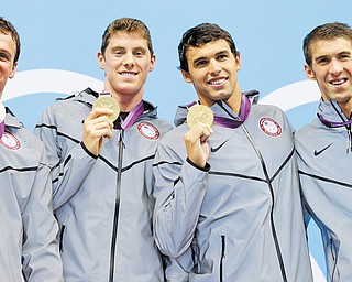 United States swimmers Ryan Lochte, left, Conor Dwyer, Ricky Berens and Michael Phelps pose with their gold medals for the men’s 4x200-meter freestyle relay swimming final at the Aquatics Centre in the Olympic Park during the 2012 Summer Olympics in London on Tuesday.